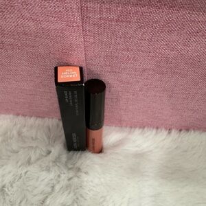 Laura Mercier
Lip Glacé Lip Gloss Color: 150 Melon Sorbet - light coral pink